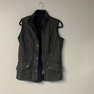 Dark green, lined Barbour vest.